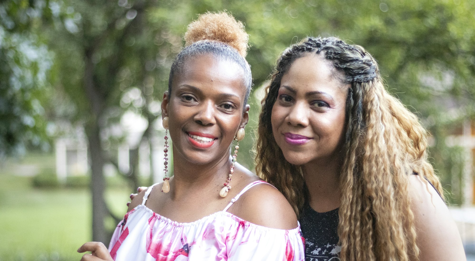 Two women smiling together outdoors