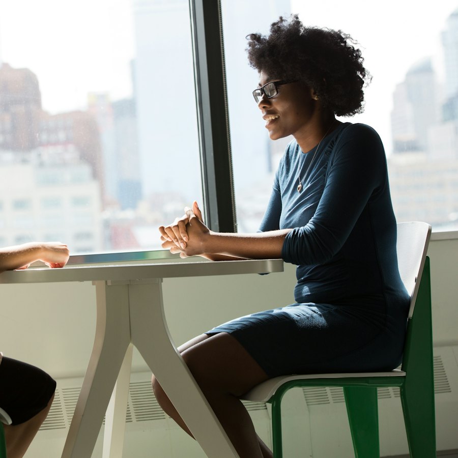 Two women talking across a table